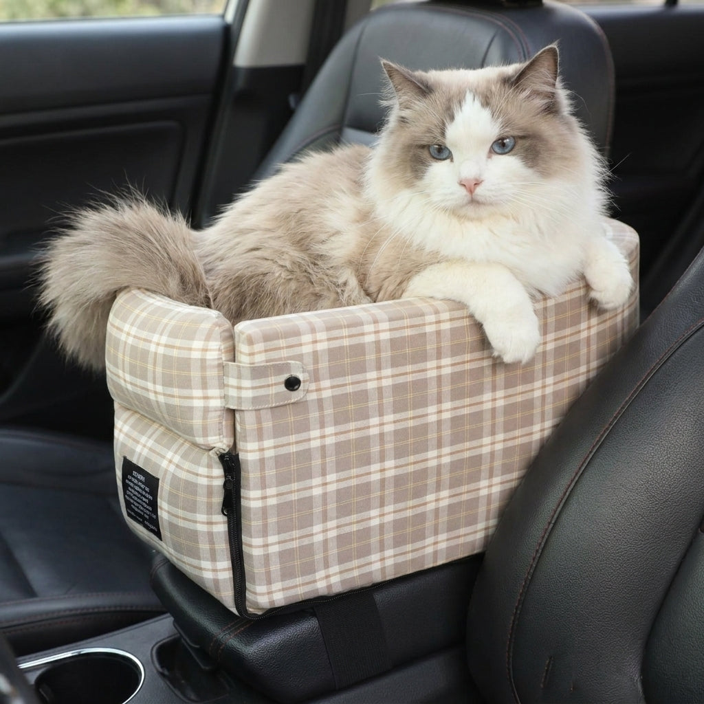Long-haired cat sitting in the Tomo Console Seat in Mocha Plaid inside a car